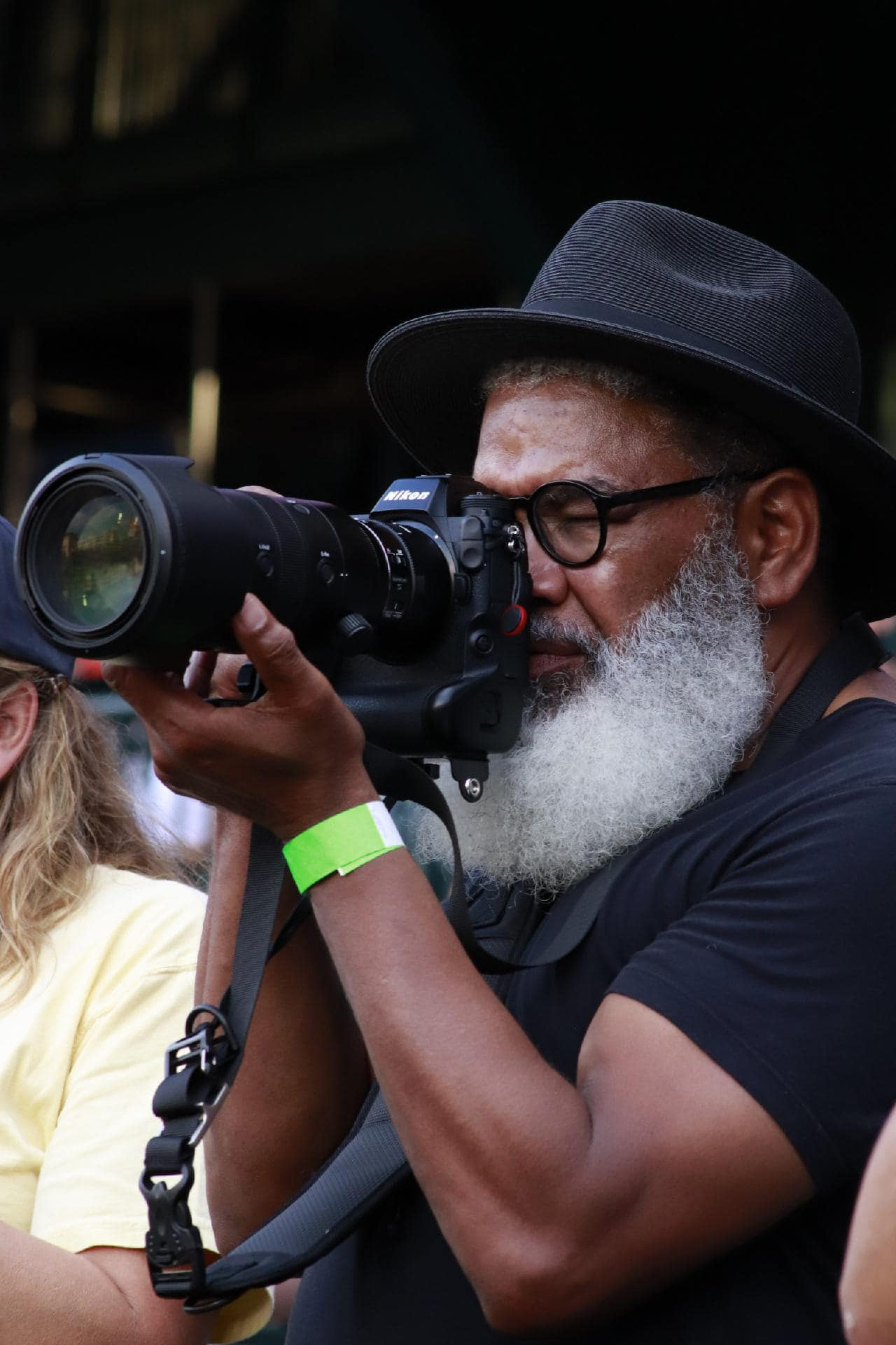 Leon McPherson photographing an event with Nikon camera