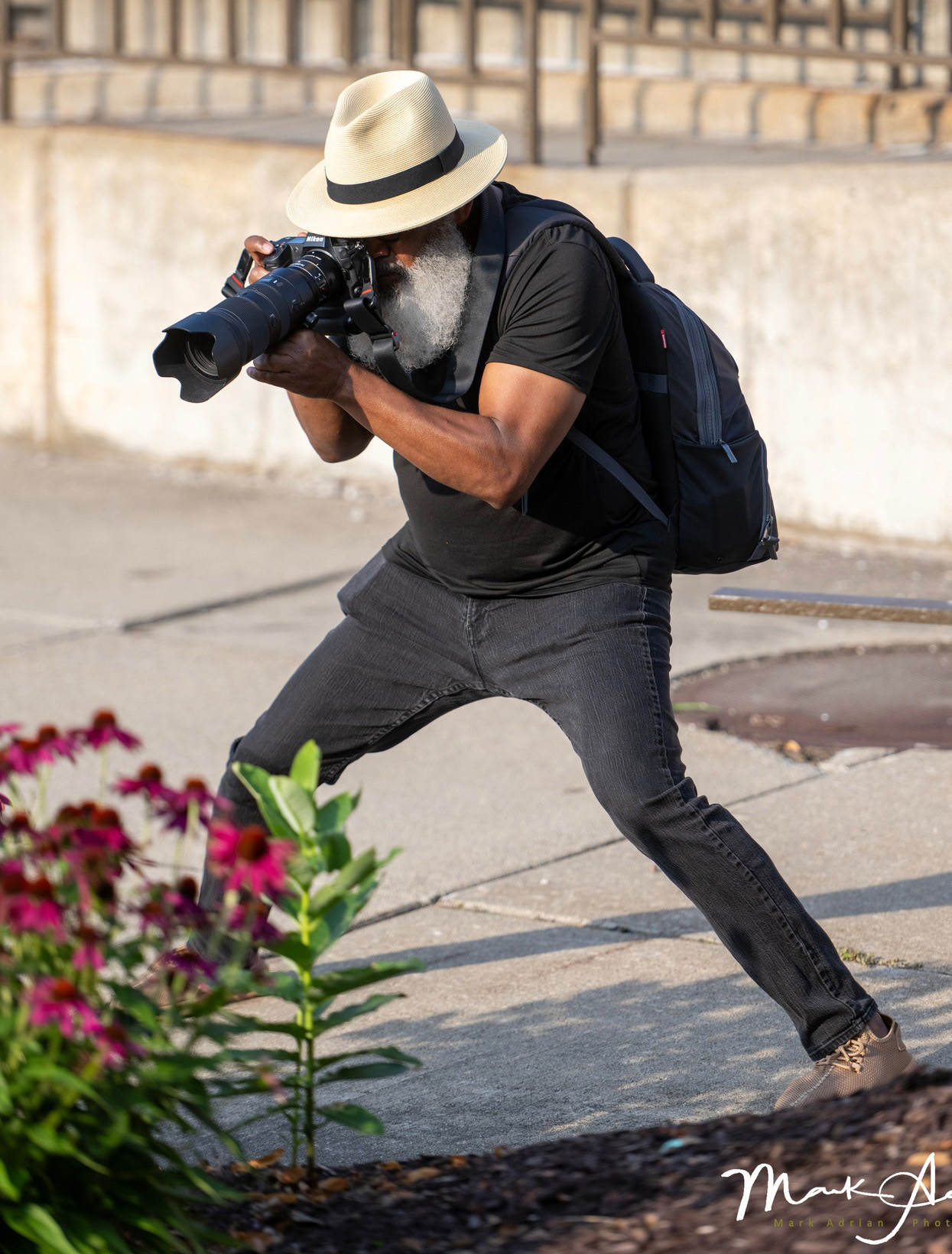 Leon McPherson working as a photographer on location